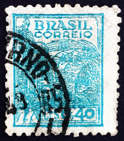 BRAZIL - CIRCA 1947: a stamp printed in the Brazil shows Wheat Harvesting Machinery, circa 1947のeditorial素材