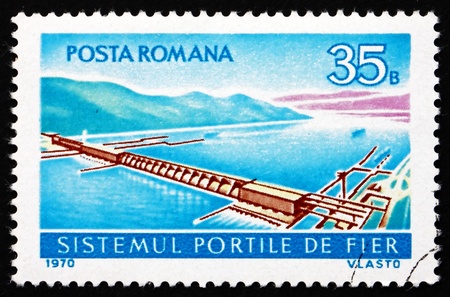 ROMANIA - CIRCA 1970: a stamp printed in the Romania shows Aerial View of Iron Gate Power Station, Hydroelectric Plant at the Iron Gate of the Danube, circa 1970のeditorial素材