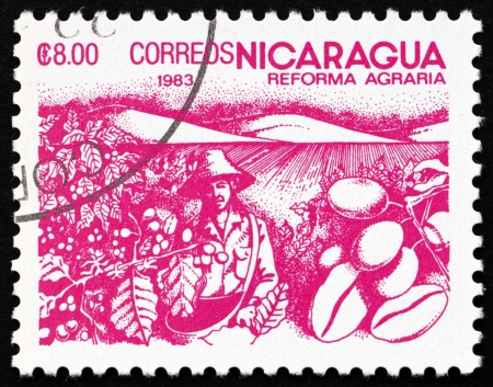 NICARAGUA - CIRCA 1983: a stamp printed in Nicaragua shows Coffee Beans, Agrarian Reform, circa 1983のeditorial素材