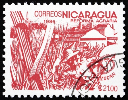 NICARAGUA - CIRCA 1986: a stamp printed in Nicaragua shows Sugar Cane, Agrarian Reform, circa 1986のeditorial素材