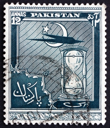 PAKISTAN - CIRCA 1951: a stamp printed in Pakistan shows Star and Crescent, Plane and Hour Glass, Fourth Anniversary of Independence, circa 1951のeditorial素材