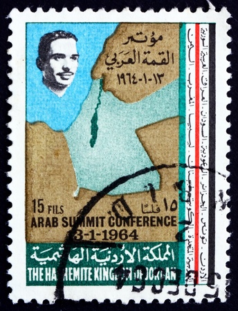 JORDAN - CIRCA 1964: a stamp printed in the Jordan shows King Hussein and Map of Jordan and Israel, circa 1964のeditorial素材