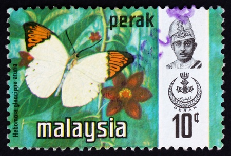 MALAYSIA - CIRCA 1976: a stamp printed in Malaysia shows Great Orange Tip, Hebomoia Glaucippe Aturia, Butterfly, circa 1976のeditorial素材