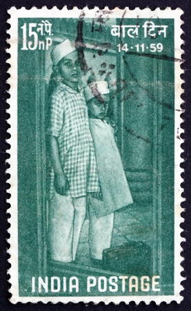 INDIA - CIRCA 1959: a stamp printed in India shows Children Arriving at Institution, Childrens Day, circa 1959のeditorial素材