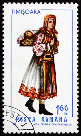 ROMANIA - CIRCA 1969: a stamp printed in the Romania shows Woman from Timisoara, Traditional Regional Costume, circa 1969のeditorial素材