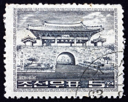 NORTH KOREA - CIRCA 1963: a stamp printed in North Korea shows South Gate, the south gate of the old walled city of Kaesong, circa 1963のeditorial素材