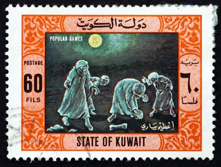 KUWAIT - CIRCA 1977: a stamp printed in the Kuwait shows Treasure Hunt, Popular Game, circa 1977のeditorial素材