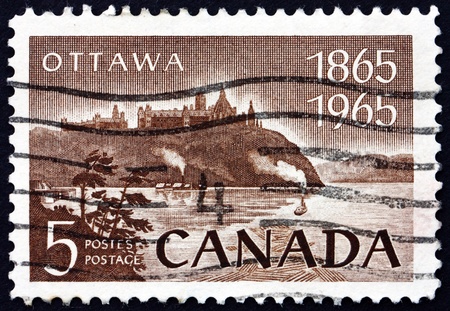 CANADA - CIRCA 1965: a stamp printed in the Canada shows Parliament and Ottawa River, Centenary of the Final Selection of Ottawa as National Capital, circa 1965のeditorial素材