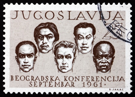 YUGOSLAVIA - CIRCA 1961: a stamp printed in the Yugoslavia shows Men of Five Races, Conference of Non-aligned Nations, Belgrade, circa 1961のeditorial素材