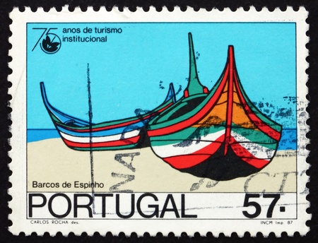 PORTUGAL - CIRCA 1987: a stamp printed in the Portugal shows Boats, Espinho, 75th Anniversary of National Tourism Organization, circa 1987のeditorial素材