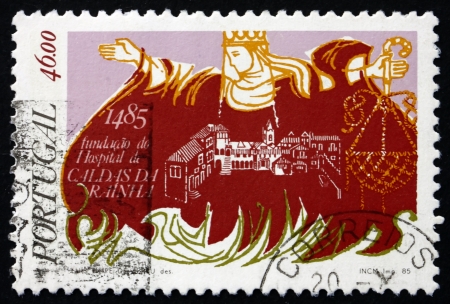 PORTUGAL - CIRCA 1985: a stamp printed in the Portugal shows Queen Leonor Founding the Caldas da Rainha Hospital, circa 1985のeditorial素材