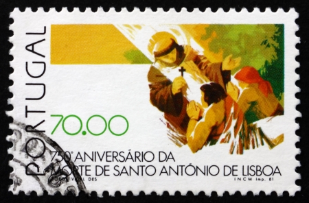 PORTUGAL - CIRCA 1981: a stamp printed in the Portugal shows St. Anthony Blessing People, 750th Anniversary of Death of St. Anthony of Lisbon, circa 1981のeditorial素材