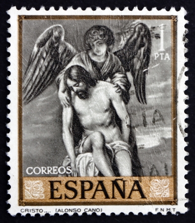 SPAIN - CIRCA 1969: a stamp printed in the Spain shows Jesus and Angel, Painting by Alonso Cano, circa 1969のeditorial素材