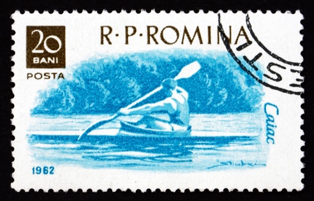ROMANIA - CIRCA 1962: a stamp printed in the Romania shows Kayak, Water sport, circa 1962のeditorial素材