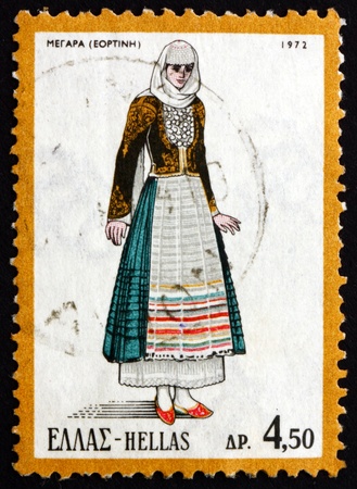 GREECE - CIRCA 1972: a stamp printed in the Greece shows Woman from Megara, Greek Regional Costume, circa 1972のeditorial素材