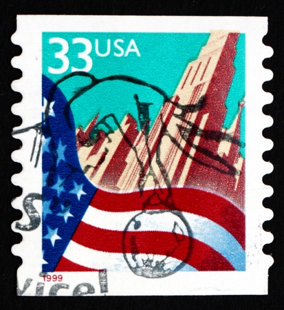 UNITED STATES OF AMERICA - CIRCA 1999: a stamp printed in the USA shows Flag and City, circa 1999のeditorial素材