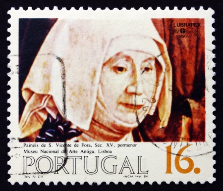 PORTUGAL - CIRCA 1984: a stamp printed in the Portugal shows Nun, Painting, 15th Century, circa 1984のeditorial素材