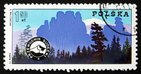 POLAND - CIRCA 1975: a stamp printed in the Poland shows Mountain Guides Badge and Sudetic Mountains, Centenary of Polish Mountain Guides Organizations, circa 1975のeditorial素材