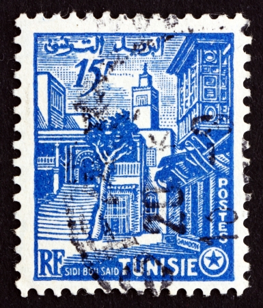 TUNISIA - CIRCA 1954: a stamp printed in Tunisia shows Street Corner, Sidi Bou Said, circa 1954のeditorial素材