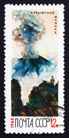 RUSSIA - CIRCA 1965: a stamp printed in the Russia shows Karymsky Erupting, Kamchatka Volcano, circa 1965のeditorial素材
