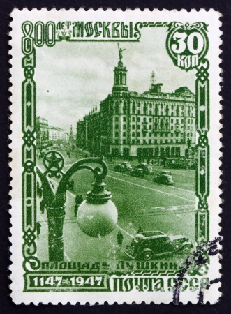 RUSSIA - CIRCA 1947: a stamp printed in the Russia shows Pushkin Square, 800th Anniversary of Founding of Moscow, circa 1947のeditorial素材