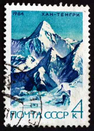 RUSSIA - CIRCA 1964: a stamp printed in the Russia shows Khan Tengri, Hantengri Peak, Mountain of the Tian Shan Mountain Range, circa 1964のeditorial素材