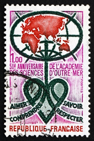 FRANCE - CIRCA 1973: a stamp printed in the France shows Academy Emblem, 50th Anniversary of Academy of Overseas Sciences, circa 1973のeditorial素材
