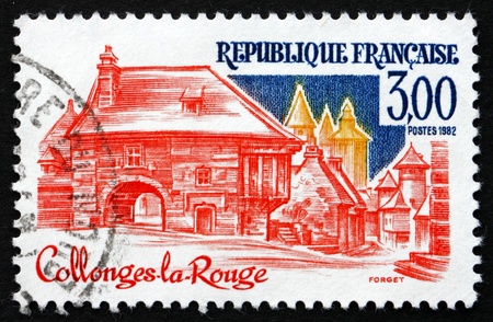 FRANCE - CIRCA 1982: a stamp printed in the France shows Collonges-la-Rouge, Correze, Limousin region, circa 1982のeditorial素材