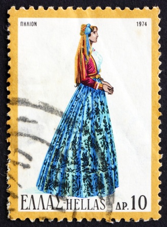 GREECE - CIRCA 1974: a stamp printed in the Greece shows Woman from Pelion, Greek Regional Costume, circa 1974のeditorial素材