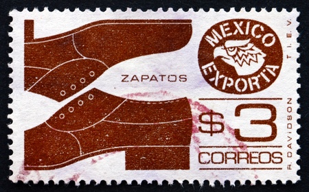 MEXICO - CIRCA 1975: a stamp printed in the Mexico shows Mens Shoes, Mexican Export, circa 1975のeditorial素材