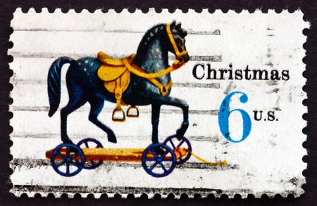 UNITED STATES OF AMERICA - CIRCA 1970: a stamp printed in the USA shows Toy Horse on Wheels, Toy, Christmas, circa 1970のeditorial素材