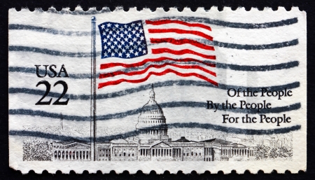 UNITED STATES OF AMERICA - CIRCA 1985: a stamp printed in the USA shows Flag over Capitol Dome, Of the People, By the People, For the People, circa 1985のeditorial素材