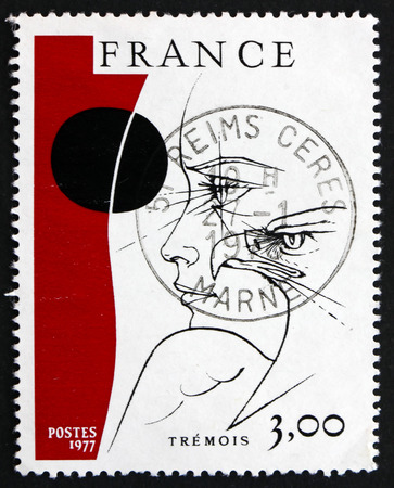 FRANCE - CIRCA 1977: a stamp printed in the France shows Head and Eagle, Painting by Pierre-Yves Tremois, circa 1977のeditorial素材