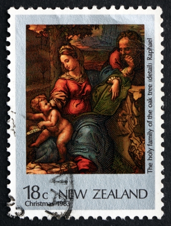 NEW ZEALAND - CIRCA 1983: a stamp printed in the New Zealand shows Holy Family of the Oak Tree, Painting by Raphael, Christmas, circa 1983のeditorial素材