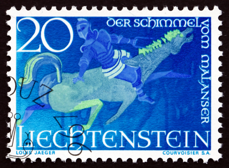 LIECHTENSTEIN - CIRCA 1967: a stamp printed in the Liechtenstein shows The Man from Malans and his White Horse, Fairy Tale of Liechtenstein, circa 1967のeditorial素材