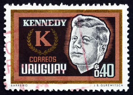 URUGUAY - CIRCA 1965: a stamp printed in the Uruguay shows John F. Kennedy, President of USA, circa 1965のeditorial素材