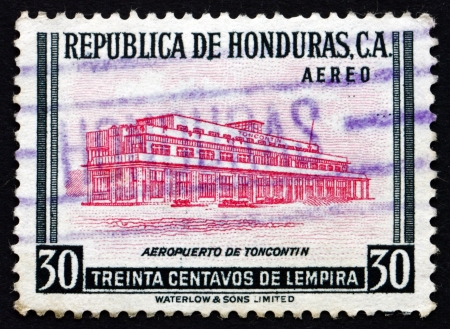 HONDURAS - CIRCA 1956: a stamp printed in Honduras shows Toncontin Airport, Tegucigalpa, circa 1956のeditorial素材