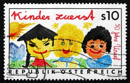 AUSTRIA - CIRCA 1996: a stamp printed in the Austria shows Children First, 50th Anniversary of UNICEF, circa 1996のeditorial素材