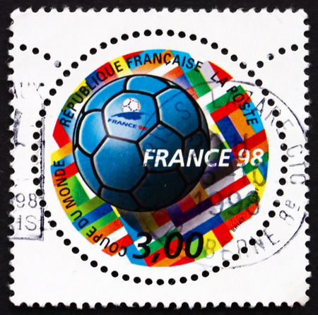 FRANCE - CIRCA 1998: a stamp printed in the France shows Soccer Ball and Flags, 1998 World Cup Soccer Championships, France, circa 1998のeditorial素材