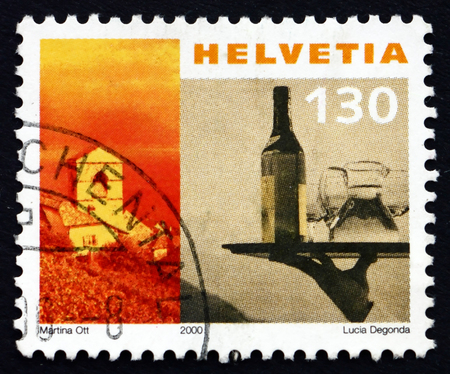 SWITZERLAND - CIRCA 2000: a stamp printed in the Switzerland shows Church of St. Saphorin and Waiter's Tray, circa 2000のeditorial素材