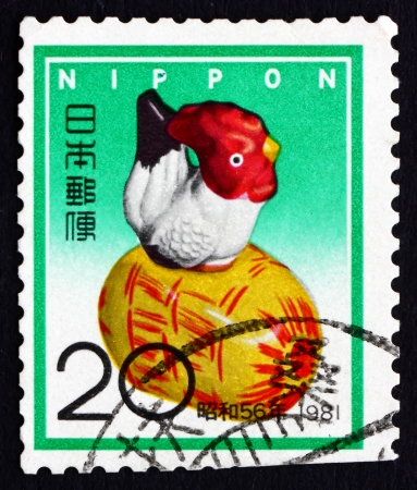 JAPAN - CIRCA 1980 a stamp printed in the Japan shows Clay Chicken, Folk Toy, New Year 1981, circa 1980のeditorial素材