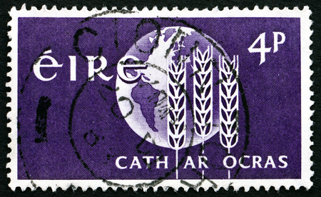 IRELAND - CIRCA 1963: a stamp printed in the Ireland shows Wheat Enblem and Globe, FAO Freedom from Hunger Campaign, circa 1963のeditorial素材