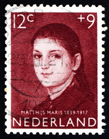 NETHERLANDS - CIRCA 1957  a stamp printed in the Netherlands shows Girlのeditorial素材