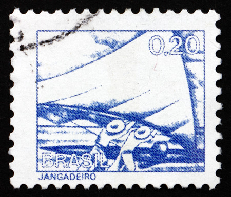 BRAZIL - CIRCA 1976: a stamp printed in the Brazil shows Raft Fisherman, circa 1976のeditorial素材