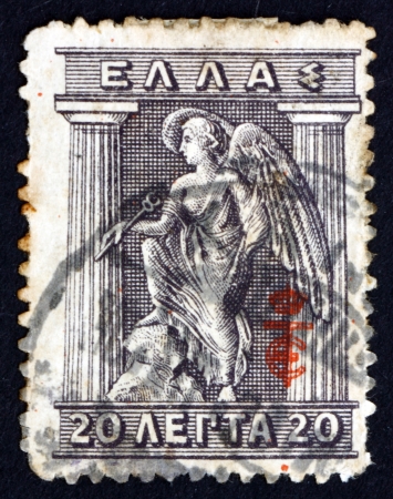 GREECE - CIRCA 1913: a stamp printed in the Greece shows Iris Holding Caduceus, Iris is Personification of the Rainbow and Messenger of the Gods, Greek Mythology, circa 1913のeditorial素材