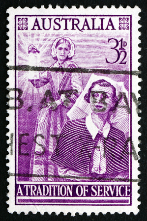 AUSTRALIA - CIRCA 1955: a stamp printed in the Australia shows Florence Nightingale and Modern Nurse, Centenary of the Founding of Modern Nursing, circa 1955のeditorial素材