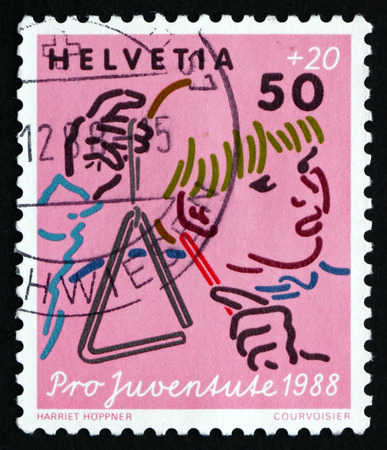 SWITZERLAND - CIRCA 1988: a stamp printed in the Switzerland shows Music, Child Development, circa 1988のeditorial素材