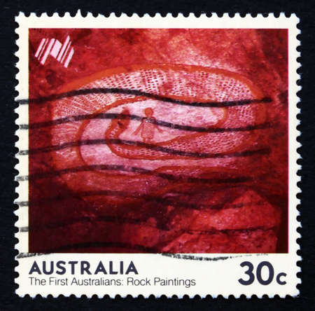 AUSTRALIA - CIRCA 1984: a stamp printed in the Australia shows Rock Python, Western Australia, The First Australians Rock Paintings, circa 1984のeditorial素材