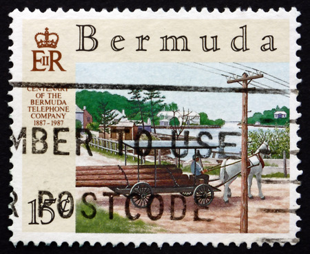 BERMUDA - CIRCA 1987: a stamp printed in Bermuda shows Telephone Poles on Wagon, Bermuda Telephone Company, Centenary, circa 1987のeditorial素材