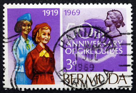 BERMUDA - CIRCA 1969: a stamp printed in Bermuda shows Girl Guides, Bermuda Girl Guides, 50th Anniversary, circa 1969のeditorial素材